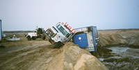 Wellsite Trailer Slips off Bedtruck on Slippery Lease
